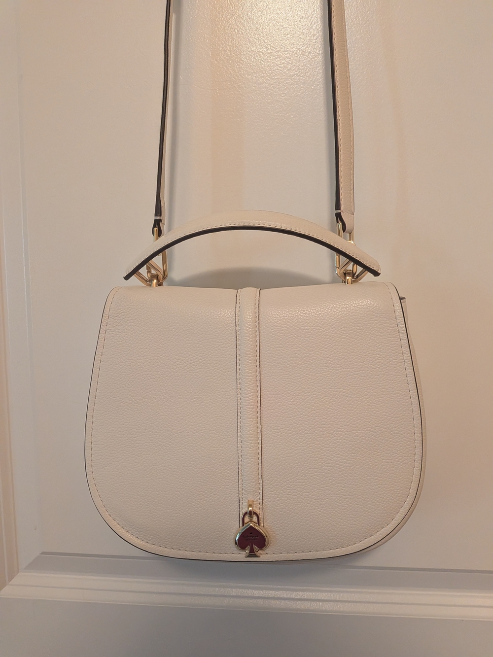 kate spade Cream Pebbled Leather Saddle Crossbody with Gold Heart Charm